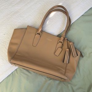 Tan Coach bag with gold zippers